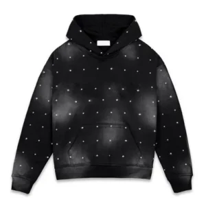 A black heavyweight hoodie with a faded distressed finish and white paint splatter patterns that resemble a starry galaxy and ringtone work all over it.