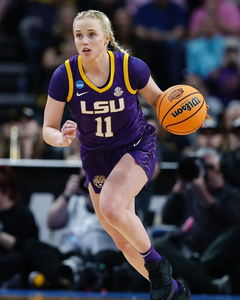 female player wearing purple basketball jersey