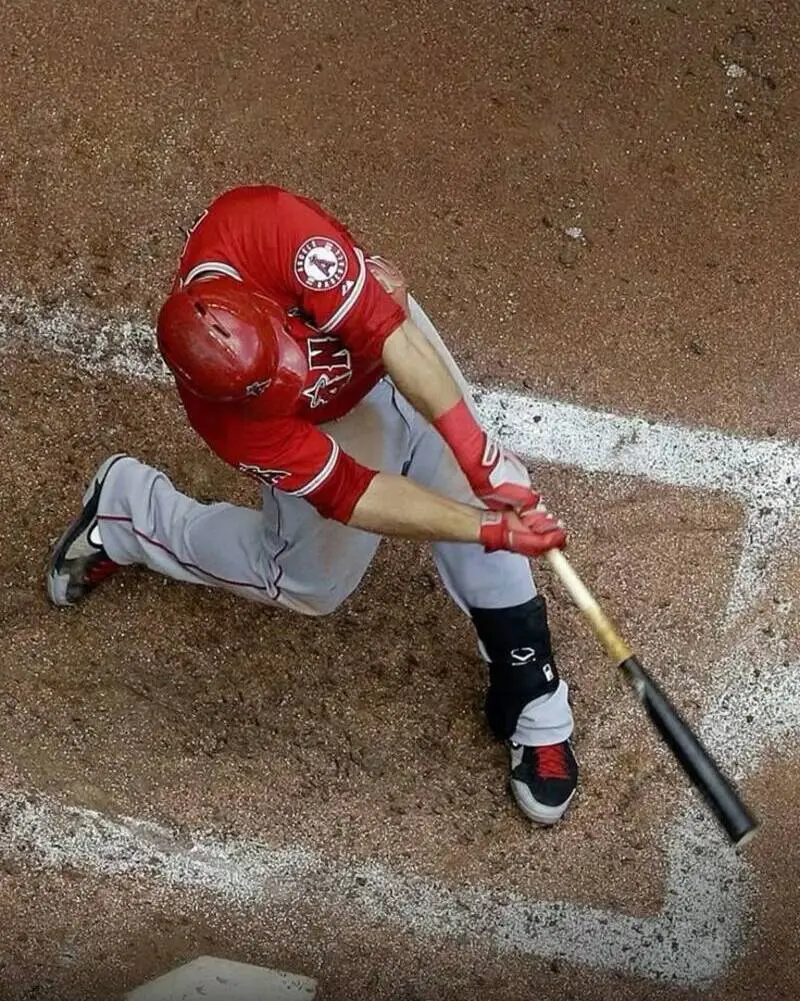 male wearing custom baseball uniform in red white bottom color