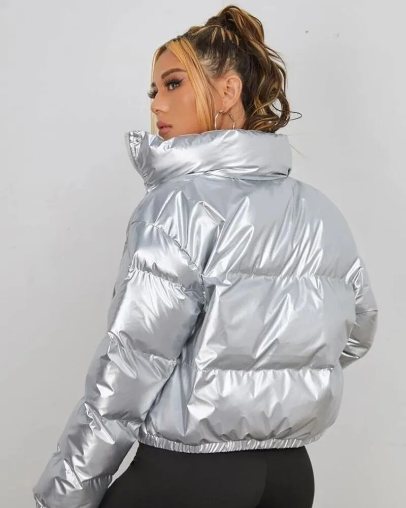female wearing silver puffer jacket