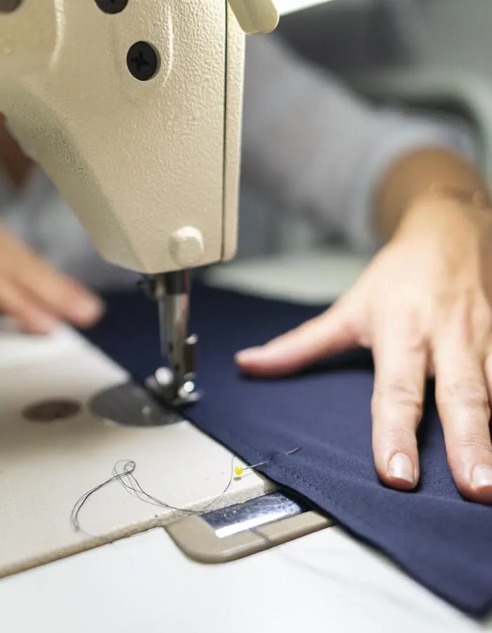 A Worker Sewing Trouser in Apparel Factory