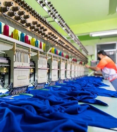 Worker working with embroidery machine