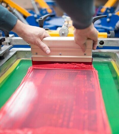 man doing screen printing