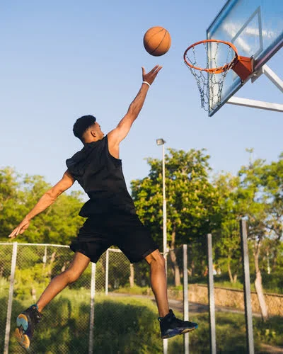 Men Wearing Basketball Uniform and Playing