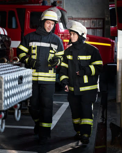 Men and Women Wearing Safety Co verall on Work