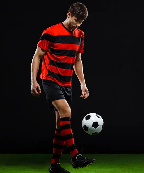 Football Player wearing custom soccer uniform Manufactured By Albeeza Apparel