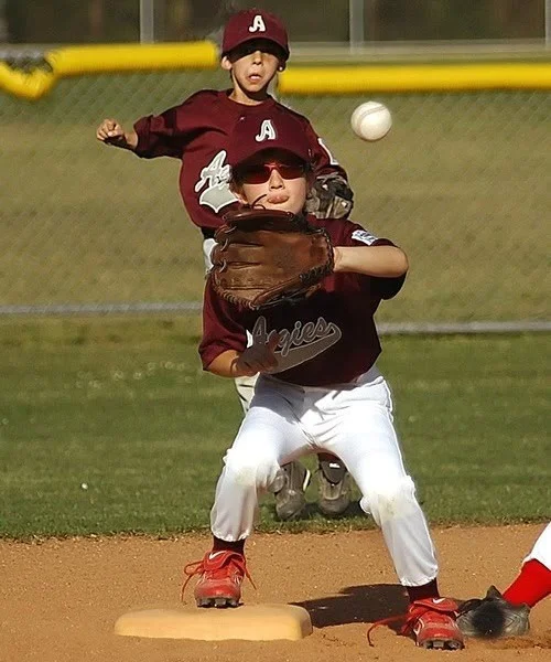 Kids Playing Baseball in Private Label Uniforms
