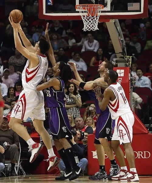 Men Playing in Custom Design Basketball Uniforms